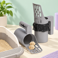 Scoop & Go grey litter scoop beside a cat litter tray