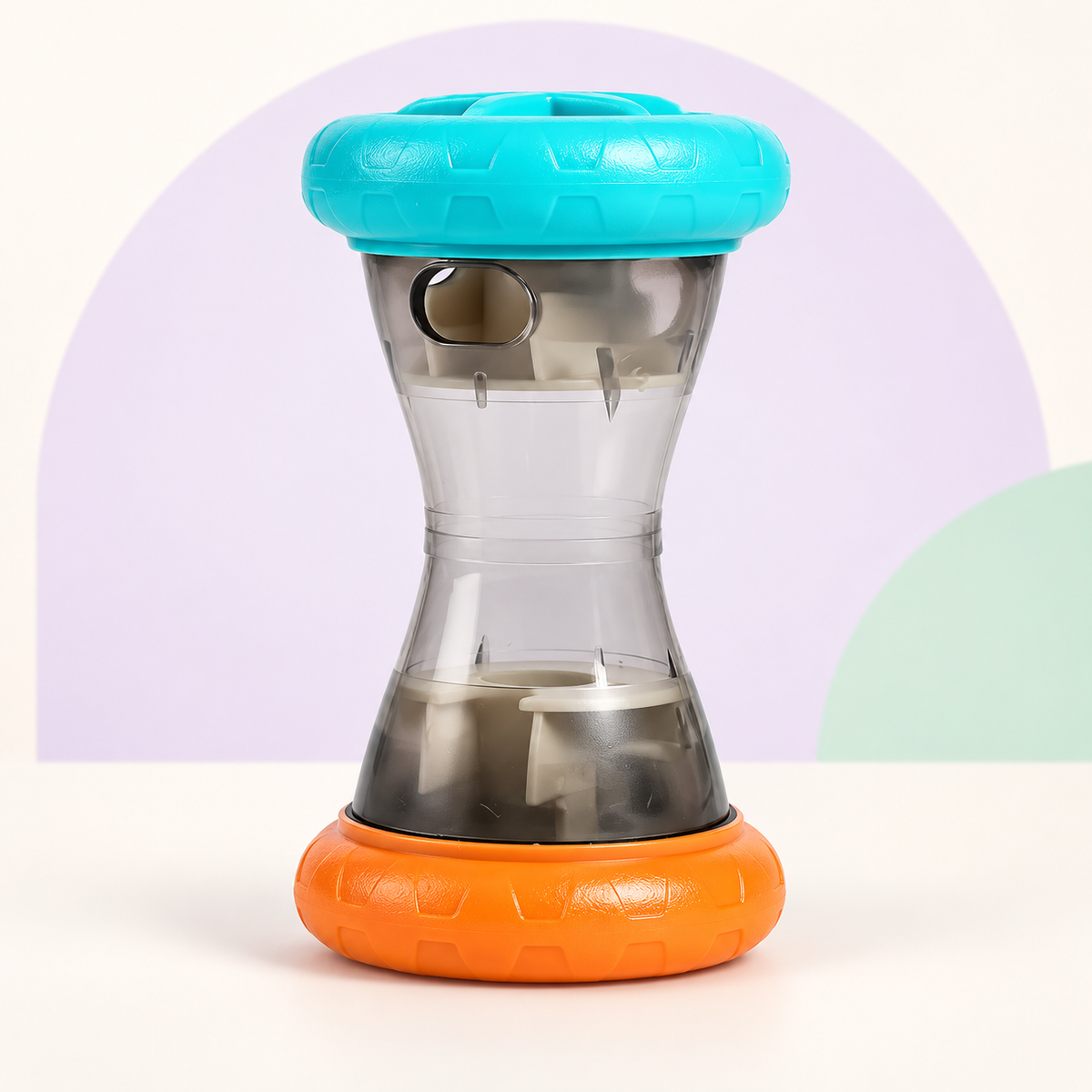 Treat Tumble blue and orange dispenser on a clean background